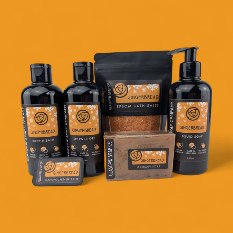 Collection of Gingerbread Soap Company products on an orange background