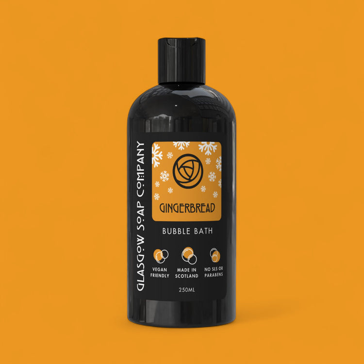 Gingerbread christmas bubble bath bottle with label on an orange background