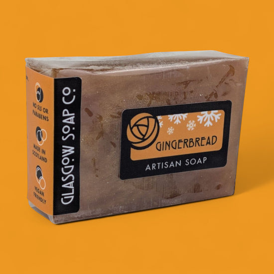 Artisan soap bar with 'Glasgow Soap Co.' branding on an orange background