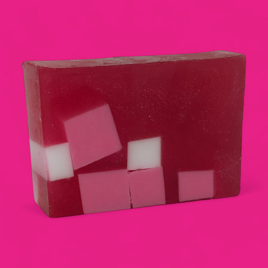 Pixelated pink and white block design on a pink background