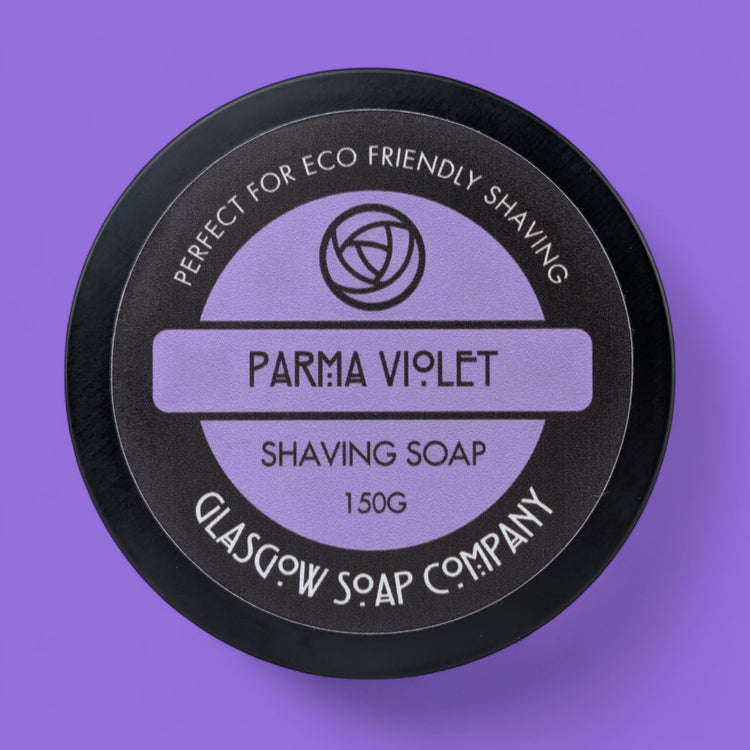 Shaving soap container with 'Parma Violet' branding on a purple background