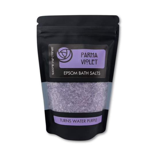 Bag of Parma Violet Epsom Bath Salts with a black and purple label on a white background