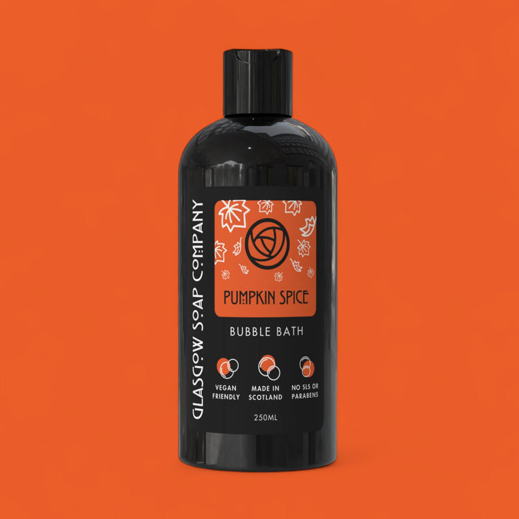 Black bottle of Glasgow Soap Company Pumpkin Spice Bubble Bath on an orange background