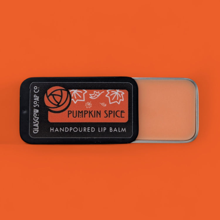 Pumpkin spice lip balm with a label on an orange background