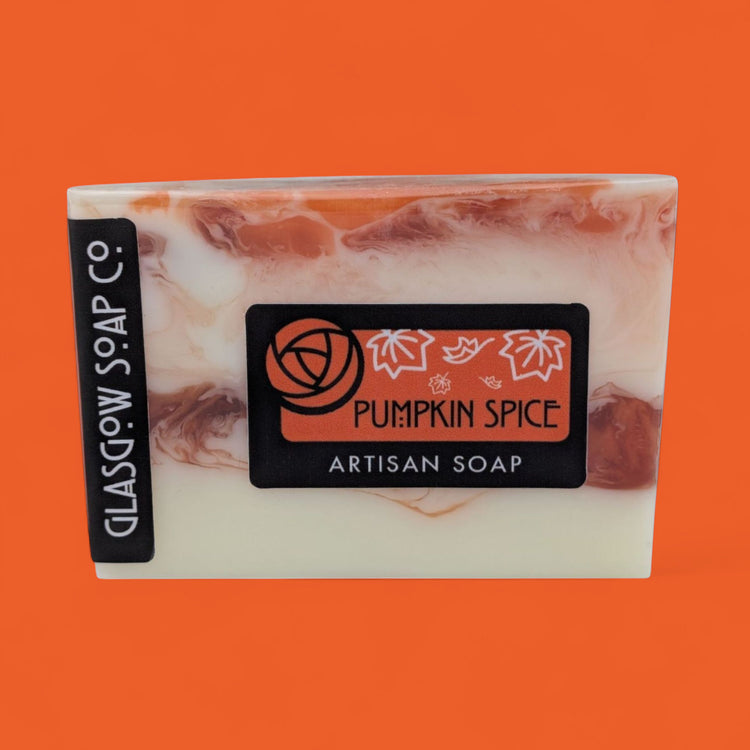 Marble-patterned pumpkin spice soap with 'Glasgow Soap Co.' branding on an orange background