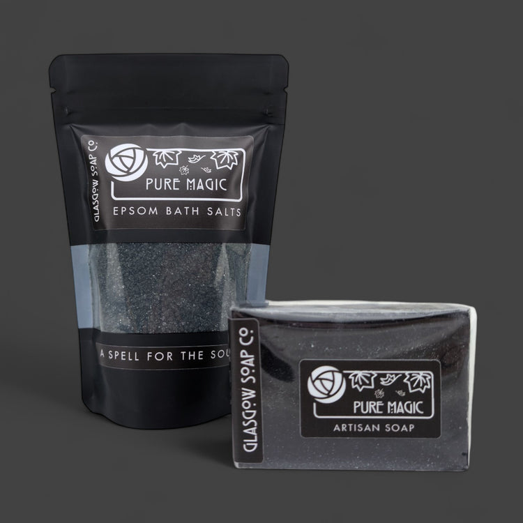 Packaged Epsom bath salts and artisan soap with 'Pure Magic' branding on a dark background