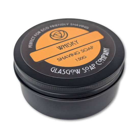 Black container of whisky shaving soap from Glasgow Soap Company on a white background