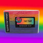 Handmade soap bar with 'Gay Bar' label on a rainbow gradient background
