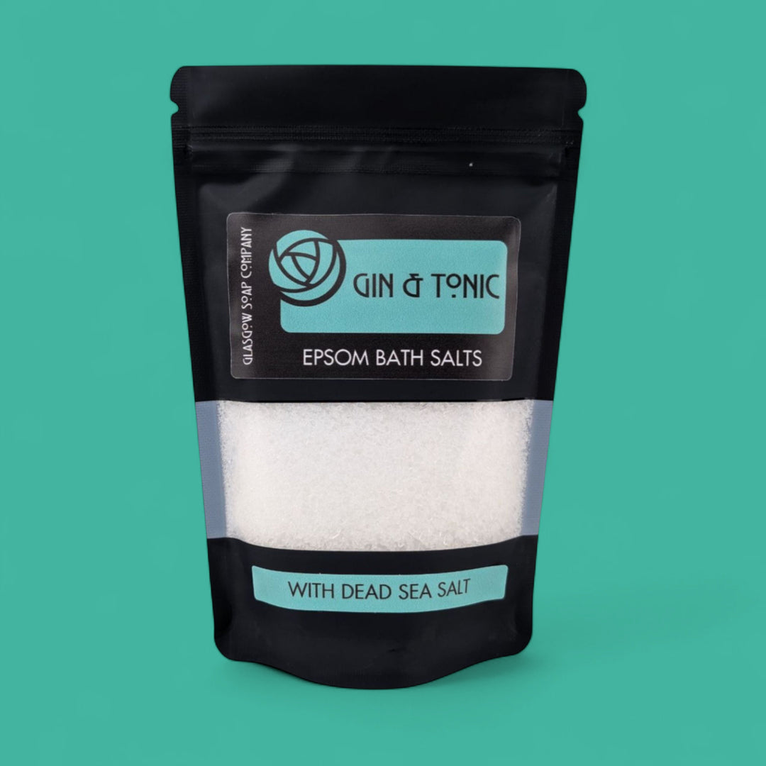 Pack of Epsom bath salts with Gin & Tonic branding on a teal background