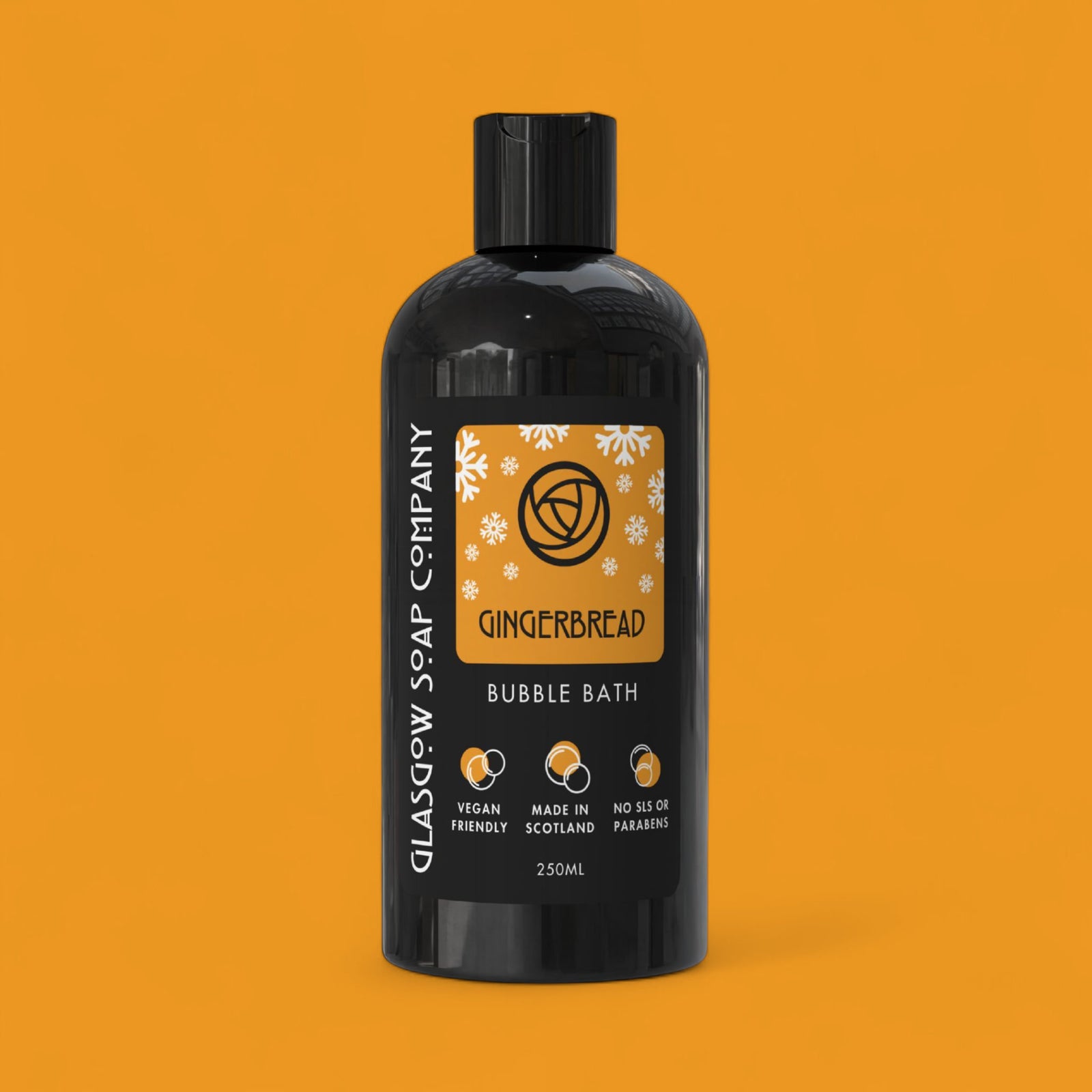 Gingerbread christmas bubble bath bottle with label on an orange background