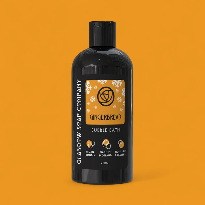 Gingerbread christmas bubble bath bottle with label on an orange background