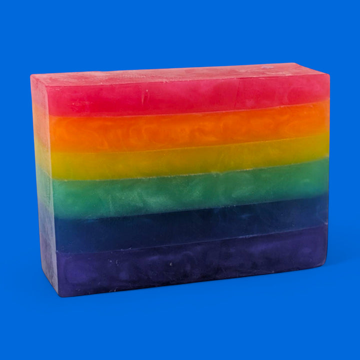 Rainbow-colored soap bar on a blue background