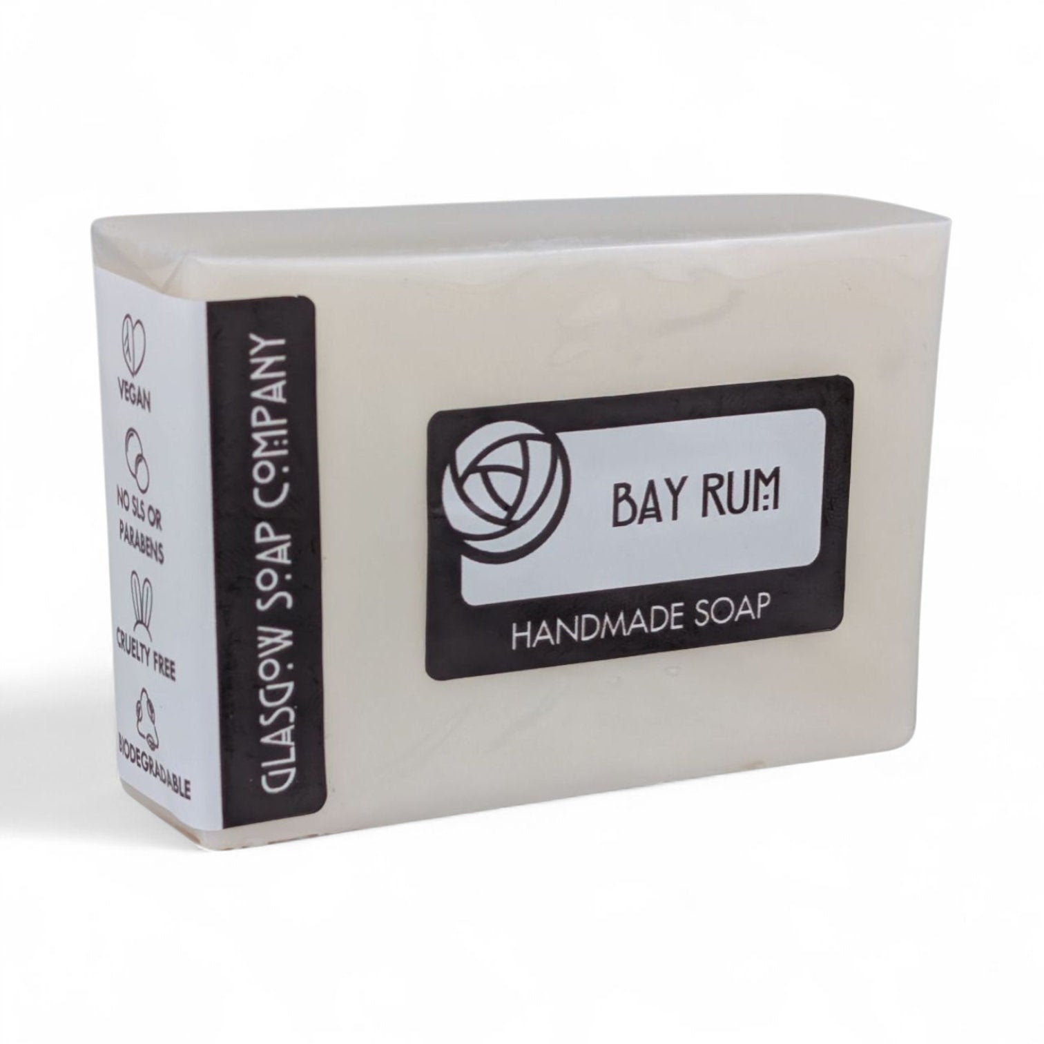 Handmade soap bar with 'Bay Rum' label on a white background
