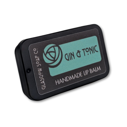 Handmade lip balm packaging with 'Gin & Tonic' branding on a white background