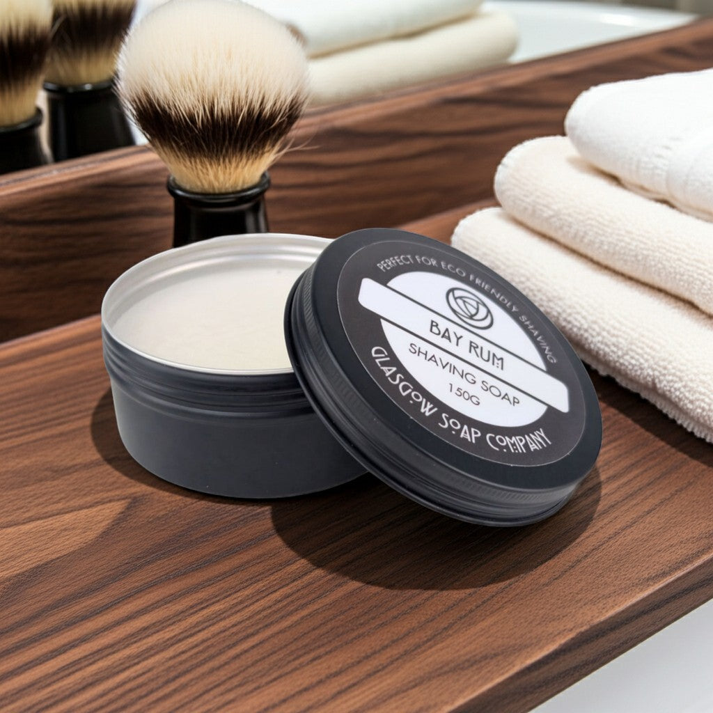 Glasgow Soap Company Ltd Bay Rum shaving soap in a tin with a creamy lather and a shaving brush.