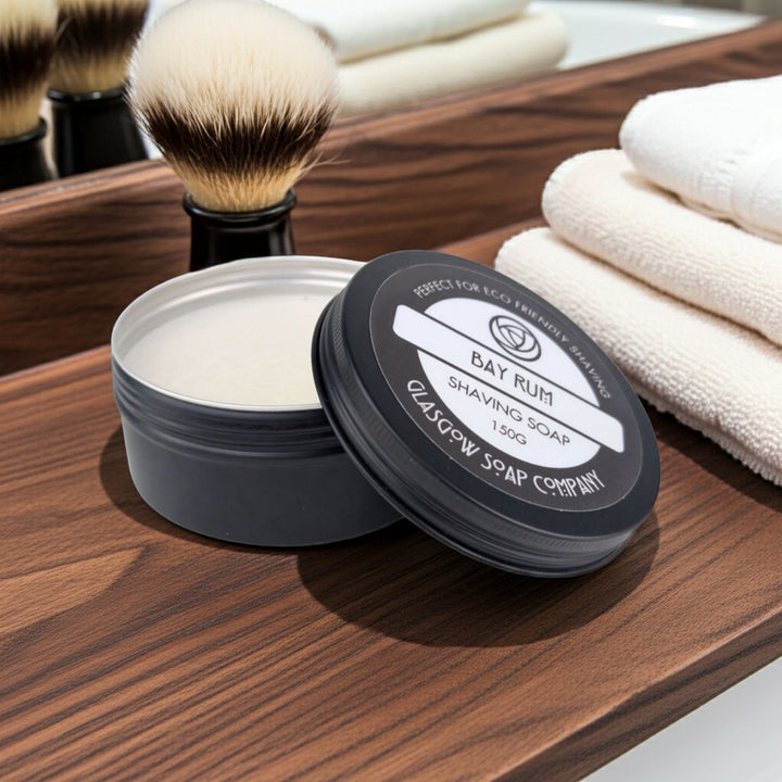 Glasgow Soap Company Ltd Bay Rum shaving soap in a tin with a creamy lather and a shaving brush.