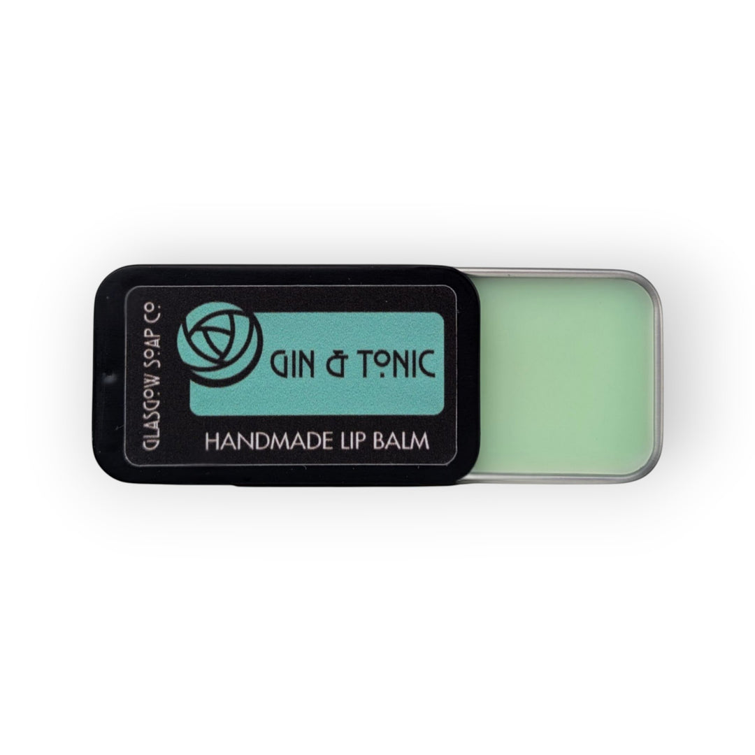 Glasgow Soap Company Ltd Gin &amp; Tonic handmade lip balm in a black tin with a light green balm.