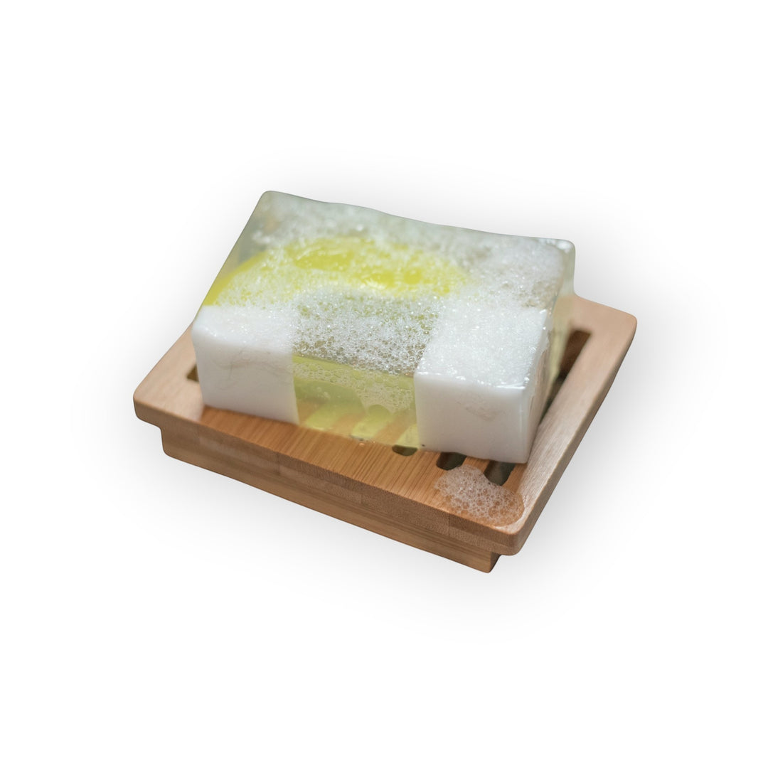 Glasgow Soap Company Ltd Gin &amp; Tonic handmade soap with citrus and herbal fragrance on a bamboo soap dish.