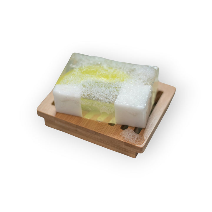 Glasgow Soap Company Ltd Gin &amp; Tonic handmade soap with citrus and herbal fragrance on a bamboo soap dish.