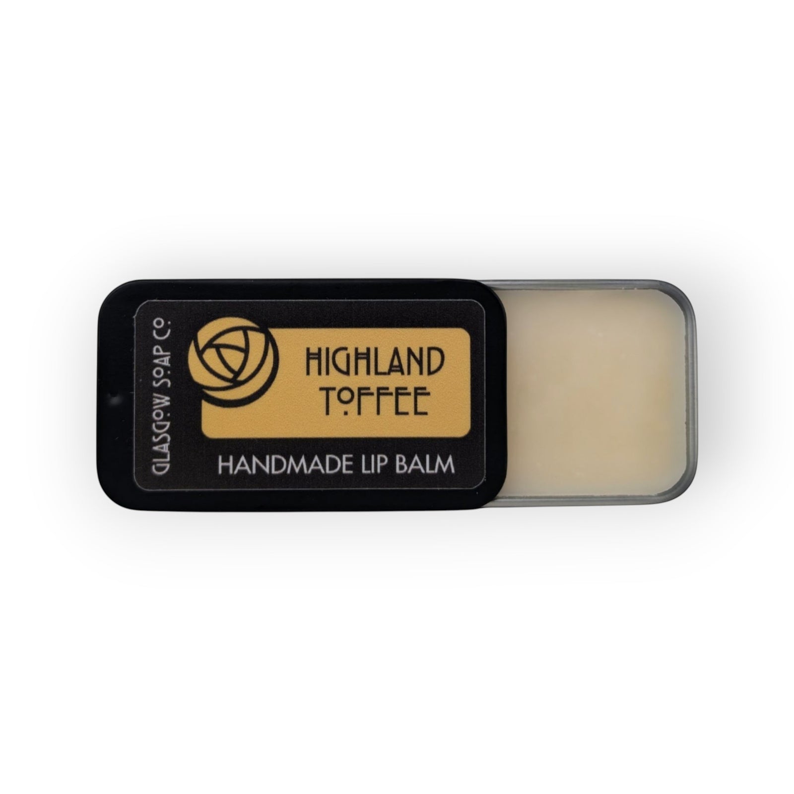 Glasgow Soap Company Ltd Highland Toffee handmade lip balm in a black slide tin, made with coconut oil, shea butter, and beeswax.