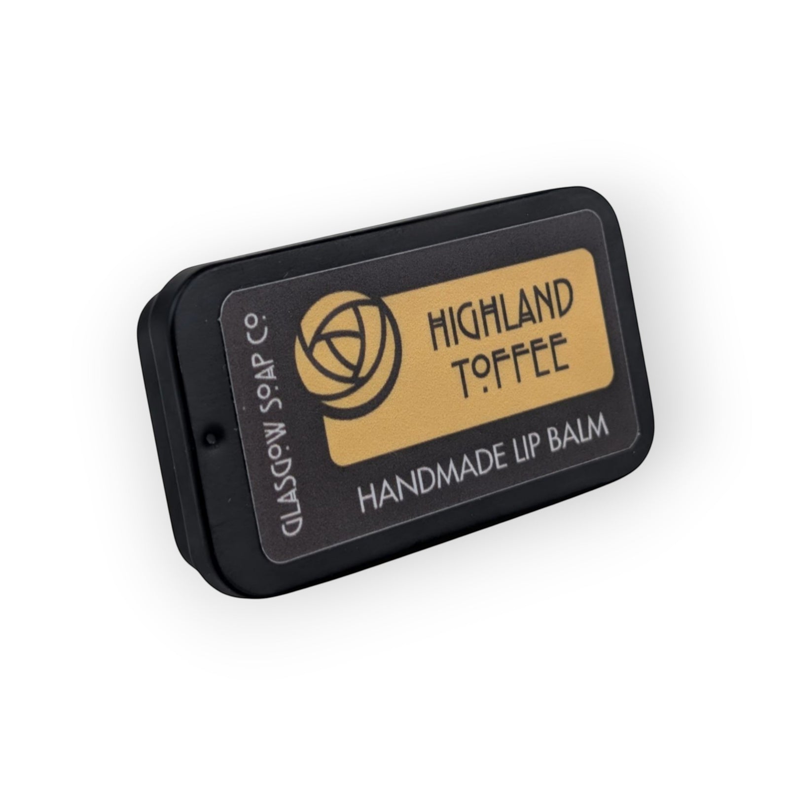 Glasgow Soap Company Ltd Highland Toffee handmade lip balm in a black tin with a gold label.