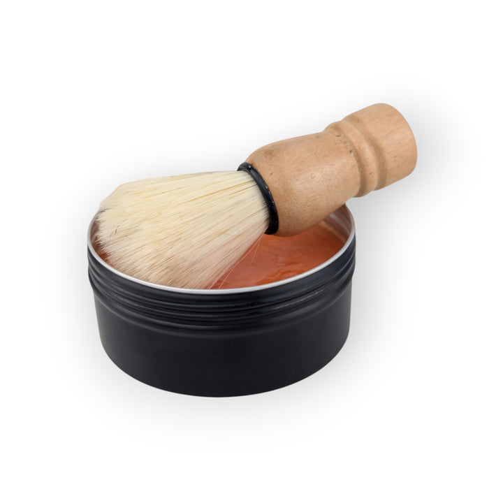 Glasgow Soap Company Ltd Iron Brew shaving soap in black tin with wooden handled brush, vegan friendly.
