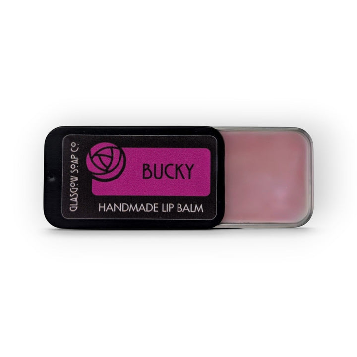 Glasgow Soap Company Ltd Bucky lip balm in a sliding black tin with pink balm, handmade in Scotland.