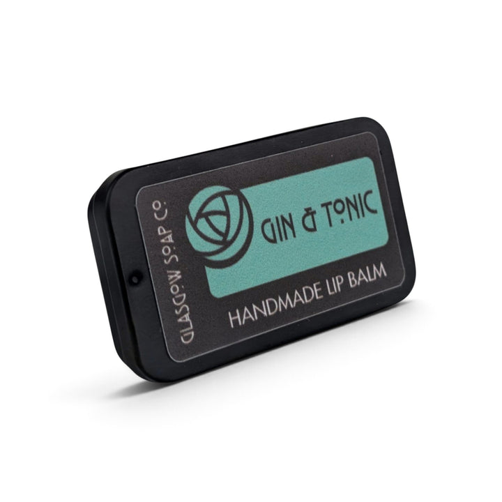 Glasgow Soap Company Ltd Gin &amp; Tonic handmade lip balm in a black metal sliding tin with a teal label