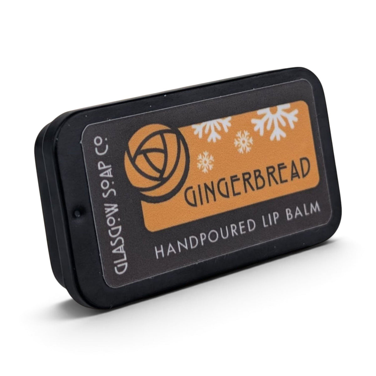 Glasgow Soap Company Ltd gingerbread lip balm in a black sliding tin with festive snowflake design