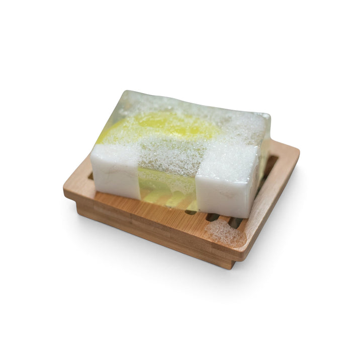Glasgow Soap Company Ltd handmade soap bar with lime and botanical fragrance on a wooden soap dish