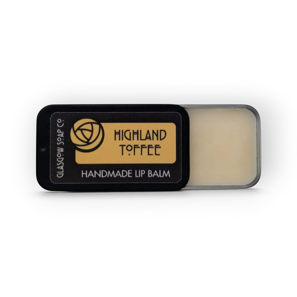Glasgow Soap Company Ltd Highland Toffee lip balm in a sliding black tin with creamy balm visible