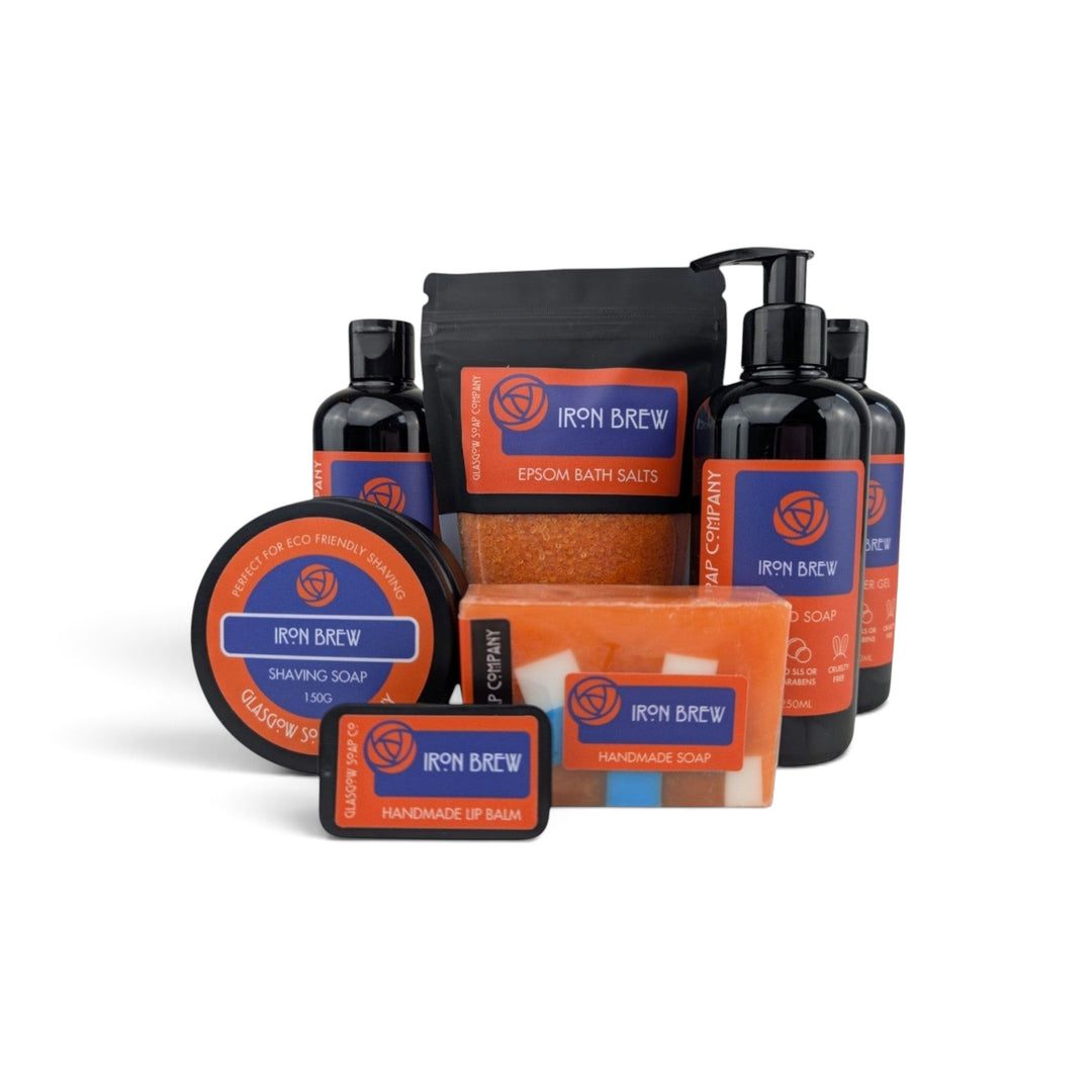 Glasgow Soap Company Ltd Iron Brew collection featuring shaving soap, bath salts, shower gel, soap bar, and lip balm.