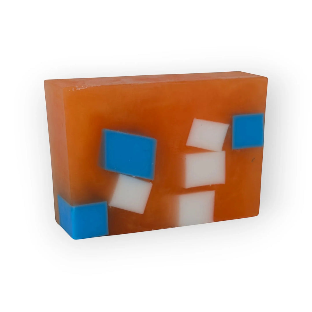Glasgow Soap Company Ltd Iron Brew handmade soap with orange, blue, and white square inclusions. Vegan and cruelty-free.