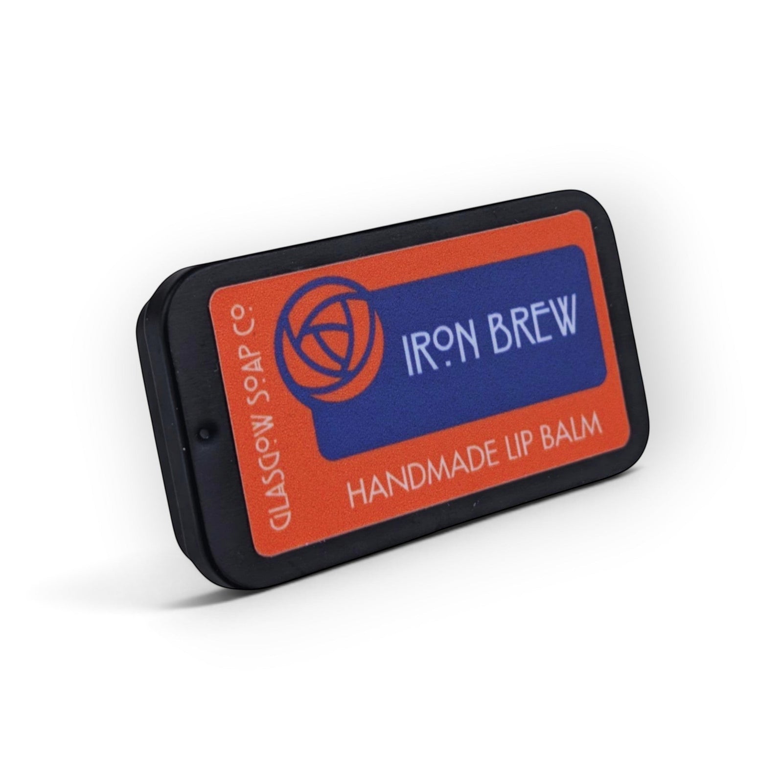 Glasgow Soap Company Ltd Iron Brew handmade lip balm in a rectangular black metal tin with orange and blue branding.