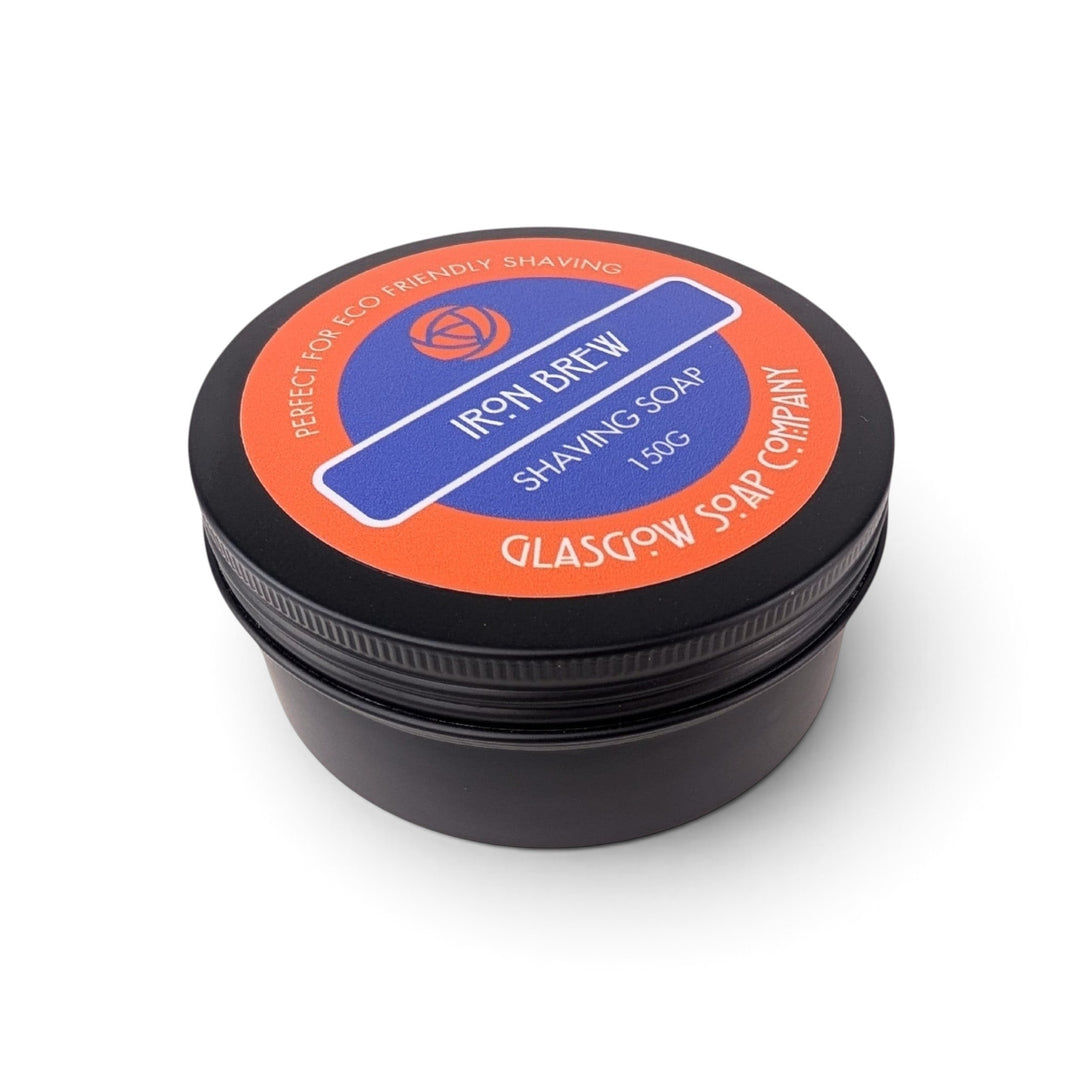 Glasgow Soap Company Ltd Iron Brew shaving soap in a black recyclable aluminium tin with orange and blue label