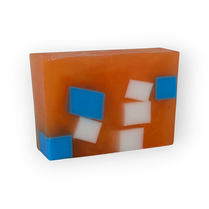Glasgow Soap Company Ltd Iron Brew soap bar, orange with embedded blue and white squares. Vegan, SLS &amp; paraben free.