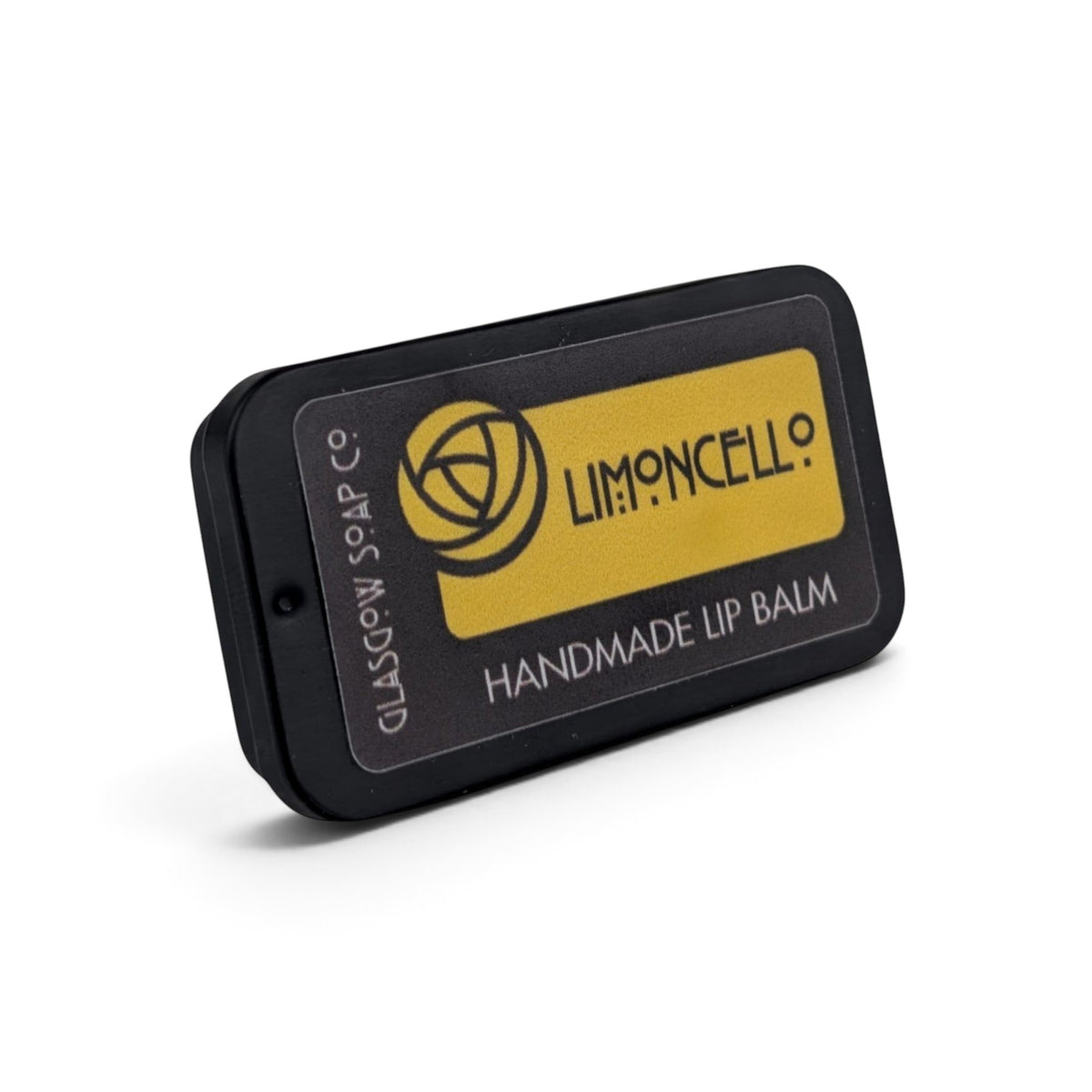 Glasgow Soap Company Ltd Limoncello lip balm in a small black sliding tin with a bright yellow lemon-themed label.