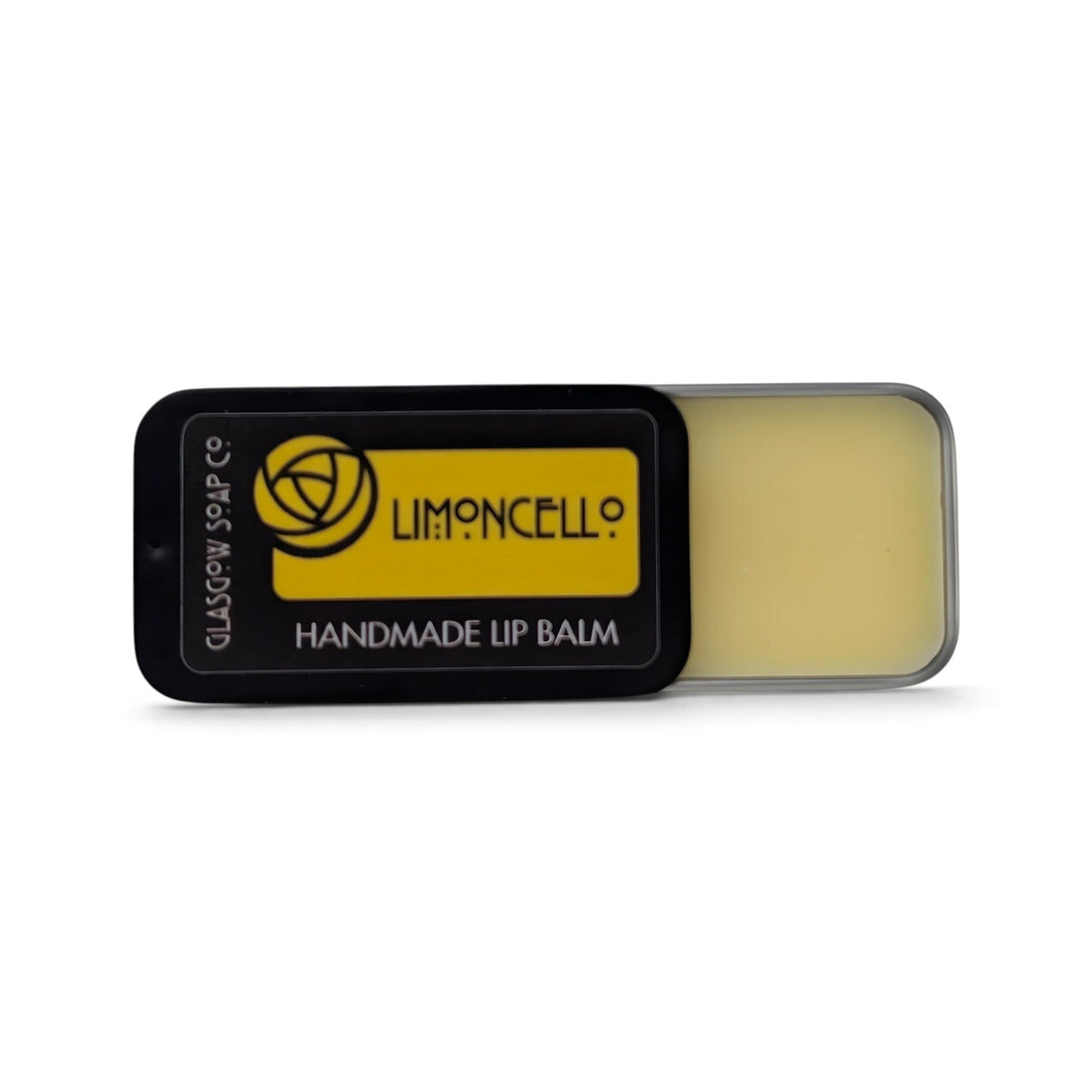 Glasgow Soap Company Ltd Limoncello lip balm in a sliding black tin with yellow label and citrus scent