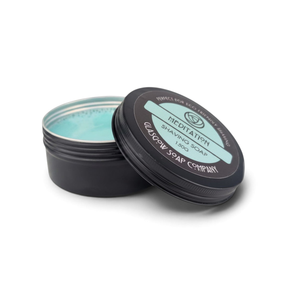 Glasgow Soap Company Ltd Meditation shaving soap in a recyclable black aluminium tin with a light blue soap base.