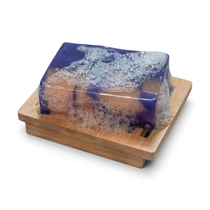 Glasgow Soap Company Ltd handmade mulled wine soap bar with lather on a wooden soap dish
