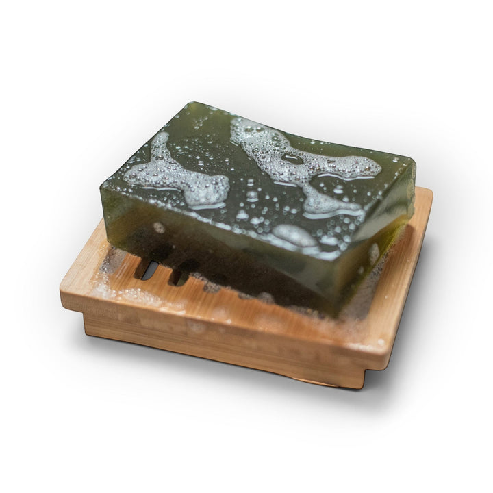 Glasgow Soap Company Ltd soothing nettle soap bar on a wooden dish with a creamy lather for sensitive skin