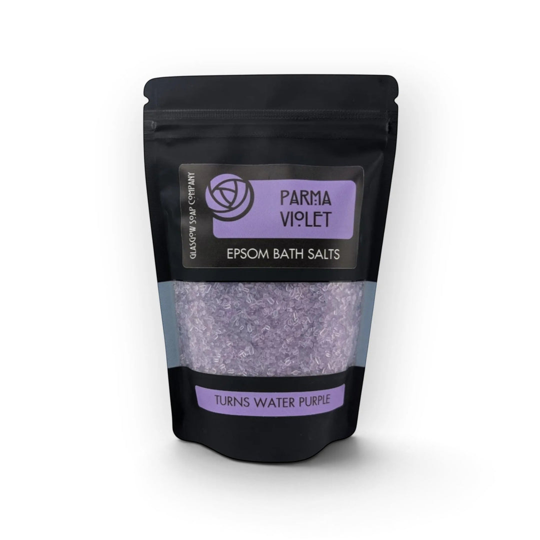Glasgow Soap Company Ltd Parma Violet Epsom bath salts in a black recyclable sachet with purple crystals visible.