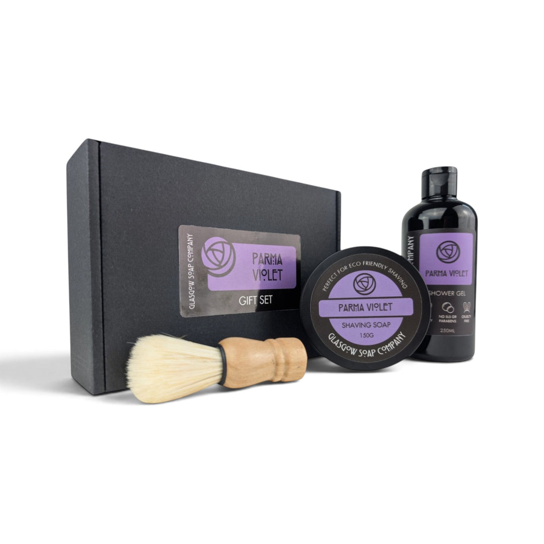 Glasgow Soap Company Ltd Parma Violet gift set including shaving soap, vegan brush, and shower gel in a black box.