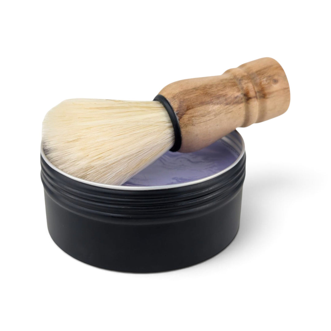 Glasgow Soap Company Ltd Parma Violet shaving soap in a black tin with a wooden vegan-friendly shaving brush