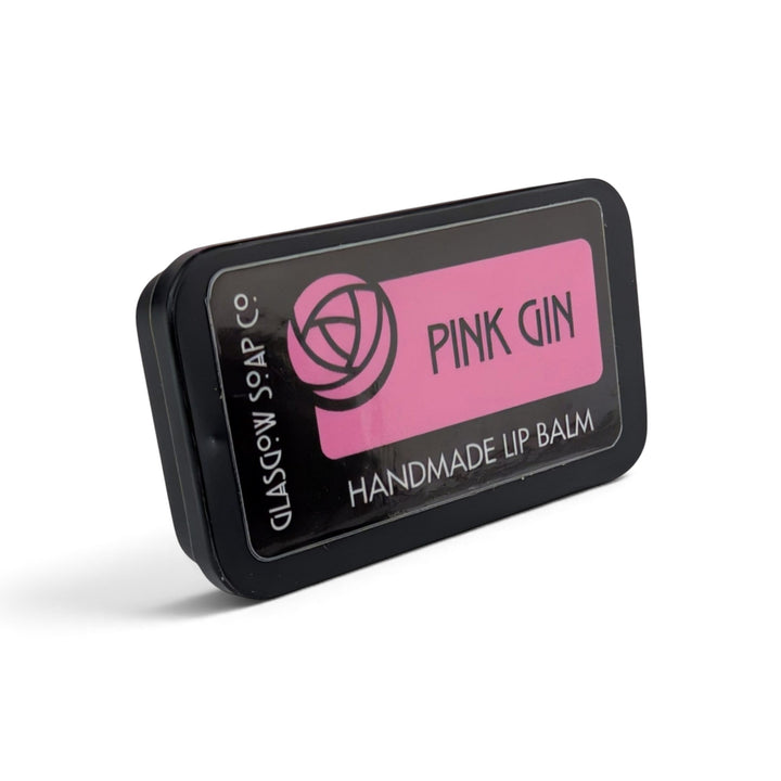 Glasgow Soap Company Ltd Pink Gin flavoured lip balm in a small black sliding tin with a pink label