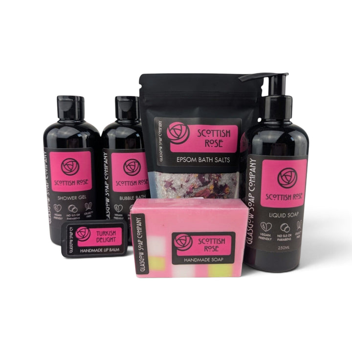 Glasgow Soap Company Ltd Scottish Rose collection featuring shower gel, bath salts, liquid soap, and handmade soap bar.