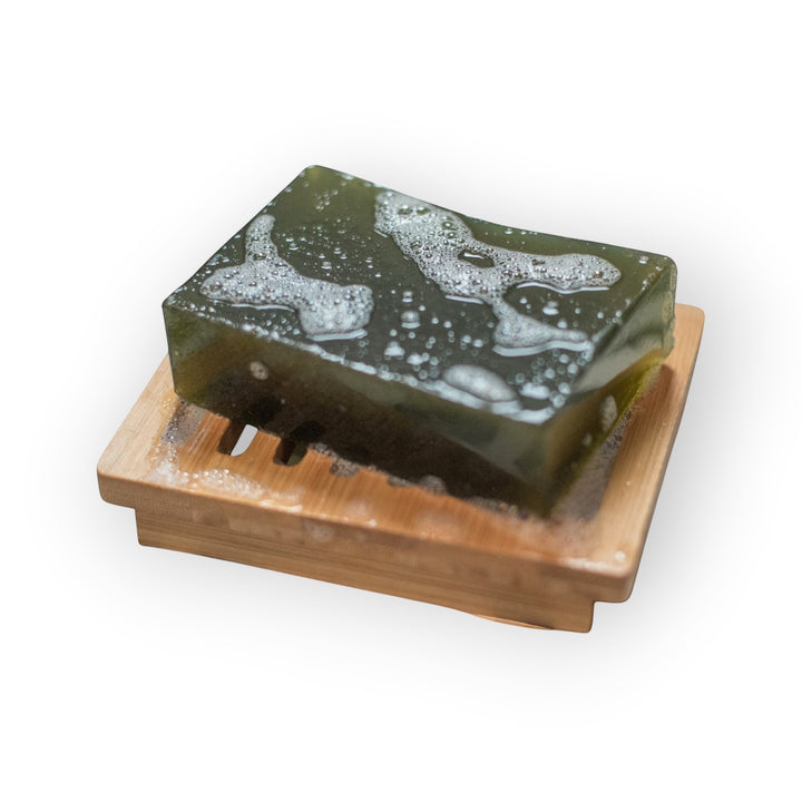 Glasgow Soap Company Ltd soothing nettle soap bar on a bamboo soap dish. Green, natural, vegan soap for dry skin.