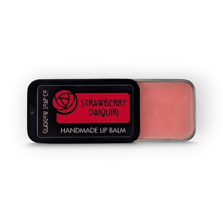 Glasgow Soap Company Ltd Strawberry Daiquiri lip balm in a sliding black tin with pink balm visible.