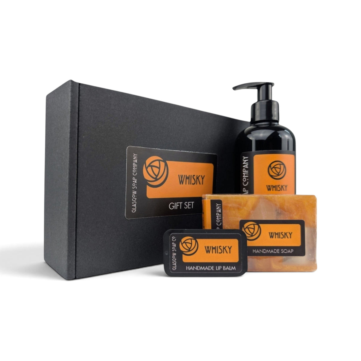 Glasgow Soap Company Ltd whisky gift set featuring liquid soap, handmade soap bar, and lip balm in a black box.