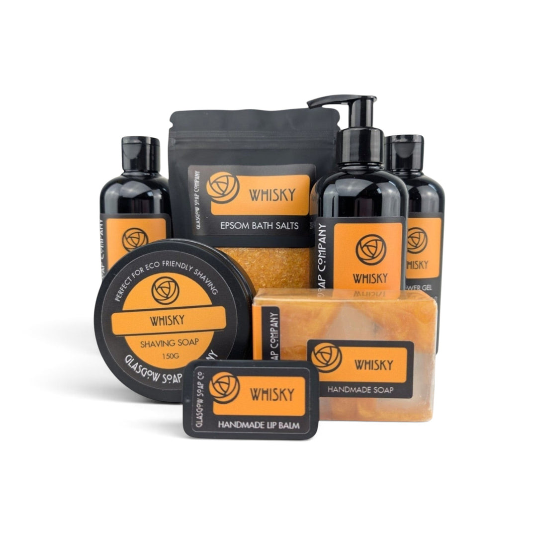 Glasgow Soap Company Ltd whisky scented grooming collection including shower gel, bath salts, shaving soap, and lip balm.